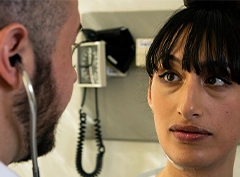 A woman is consulting a cosmetic surgeon for a gender reassignment surgery and health issues.